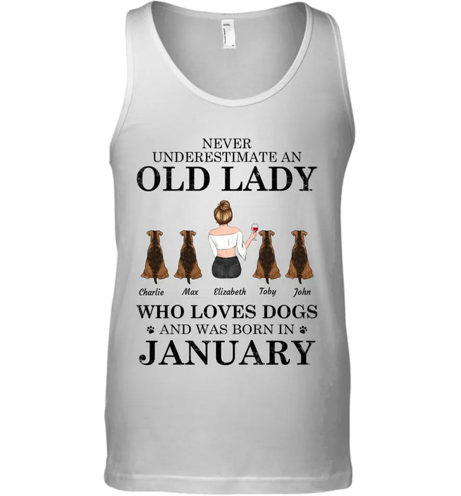 "Never underestimate an old lady who loves Dogs/Cats and was born in " girl and dog,cat, month personalized T-Shirt